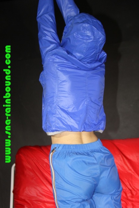 White girl is restrained with her hands above her head in nylon clothing 55811519