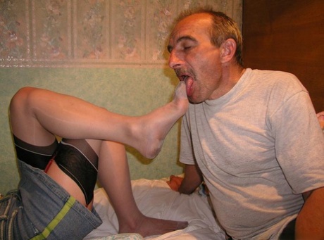 Fully clothed woman has her submissive man lick her nylon covered feet 87641767