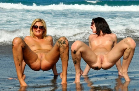Two girls ditch their bikinis at the ocean to go naked in sunglasses 95333032