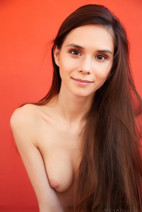 Long haired teen Leona Mia strikes confident poses while completely naked 45281896