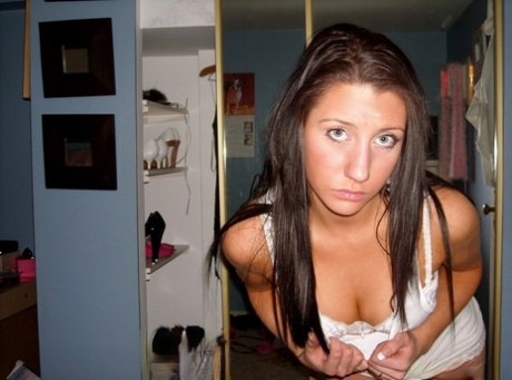 Teen solo girl Sky strips down to white lace underwear in front of a mirror 57429179