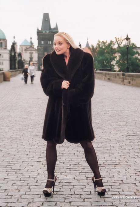 Hot blonde Silvia Saint fingers her bald pussy wearing a fur coat in public 69523664