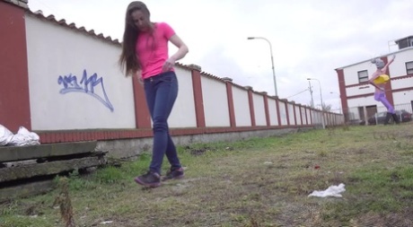 White girl Valentina Ross takes a piss in the field near a fence 88599563