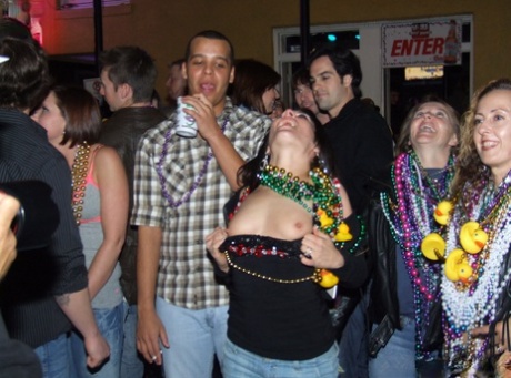 Inebriated girls expose their breasts during an outdoor gathering 37863981