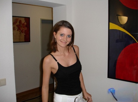 Slim amateur shows her big tits before freeing tight ass and twat from thong 93932135