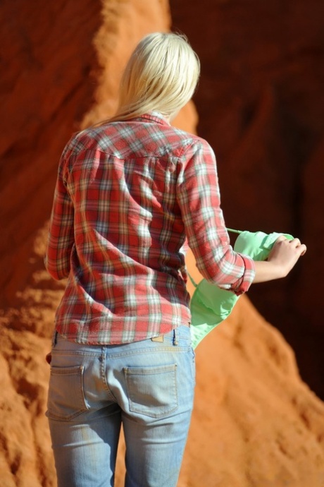 Blonde model Lada Love sports red lips while getting naked on red rocks 42189942