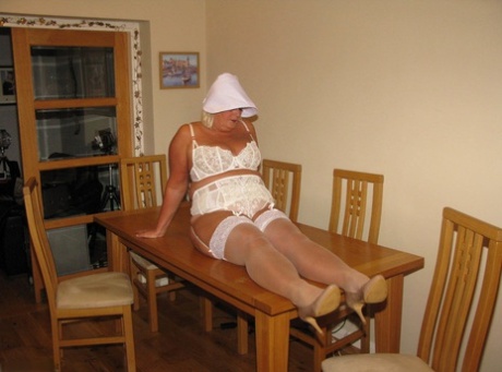 Mature blonde BBW Chrissy Uk free her private parts on a kitchen table 92229409