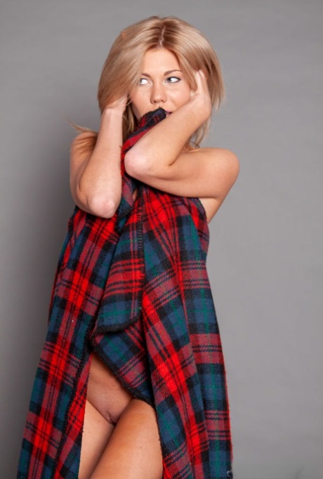 18-year-old blonde Sarah C strikes confident poses while buck naked 68409207