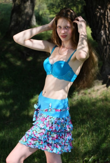 Barely legal girl Nicole exposes her slim body under a tree 10758700
