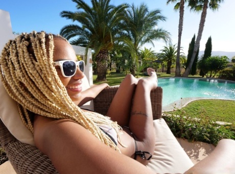 Ebony beauty Romy Romee takes off her bikini on a patio in sunglasses 20079140