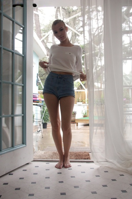 Blonde amateur Sofia Sweet uncovers her tiny boobs in denim shorts 97199475