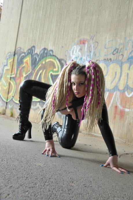 Solo model Avengelique tugs on her pigtails while modelling in latex wear 18974171