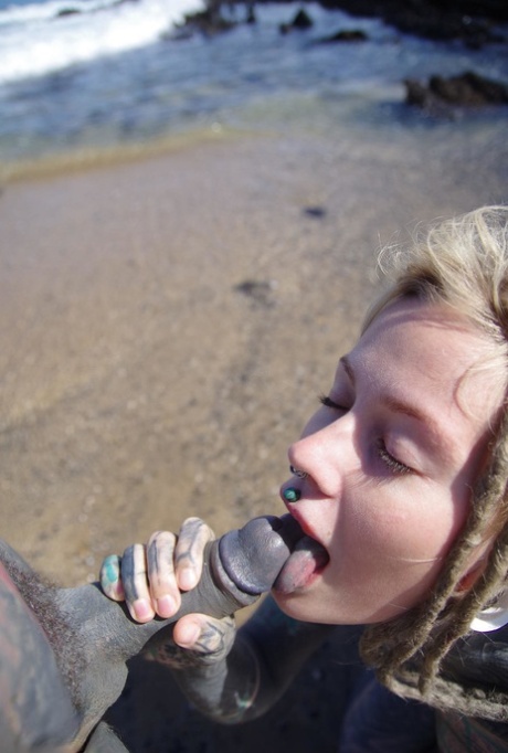 Tattooed girl jerks and sucks a tattooed penis near the ocean 68055980