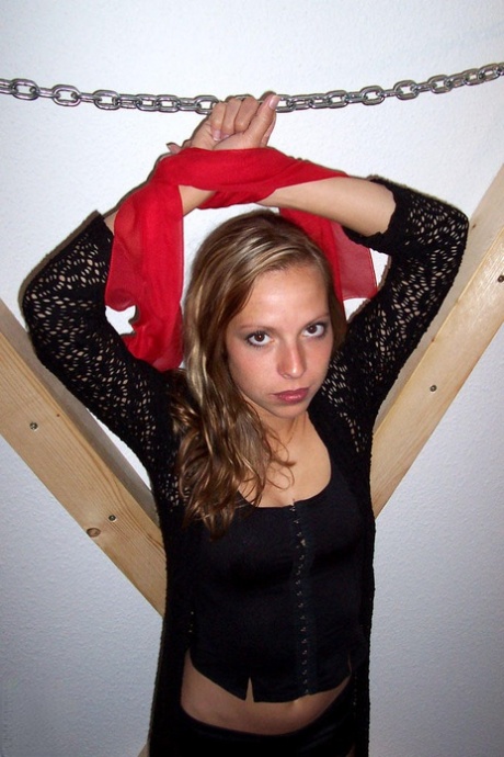 Clothed blonde Sweet Kathy is affixed to a St Andrew's Cross 20081774