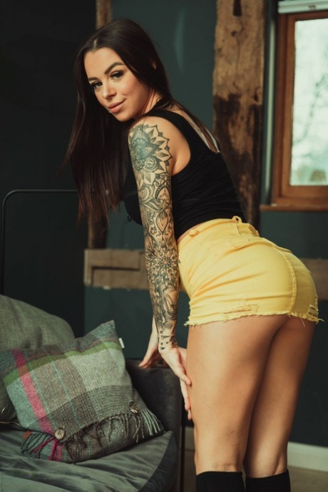 Tattooed model Mia Stryker uncups her nice tits while wearing black knee socks 21002673