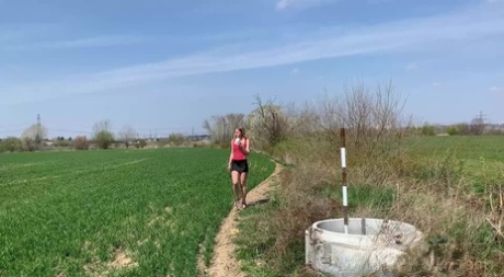 Blonde chick Claudia Macc takes a piss while out in a farmer's field 89972726