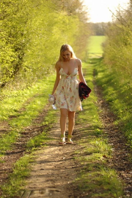 Blonde amateur Hayley Marie Coppin strips naked on a blanket in the woods 48725487