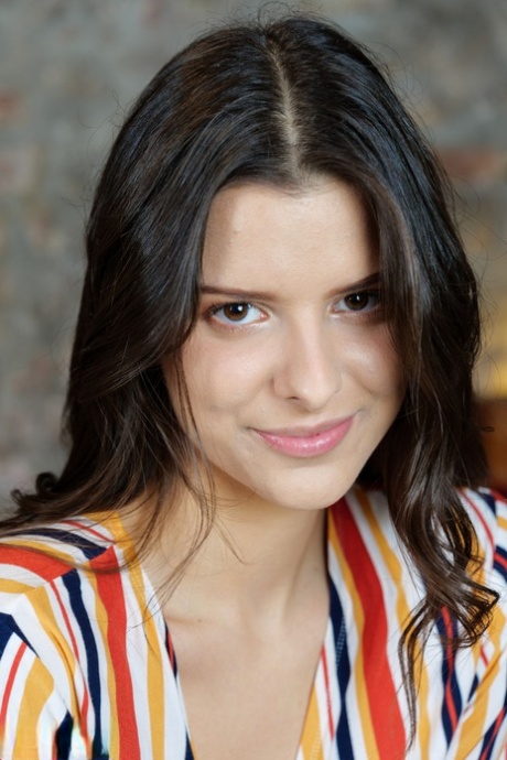 Young brunette Amelia Grace slowly undresses on top of a wooden trunk 40995154