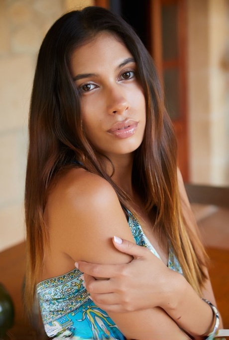 Tall Latina teen Baby Nicols slips out of a long dress to pose nude on a table 67438558