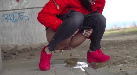 Solo girl Billie takes a badly needed piss underneath an overpass 19410781