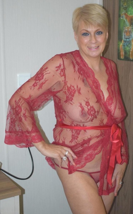 Mature blonde woman Dimonty looses her saggy tits from a sheer robe 35137538