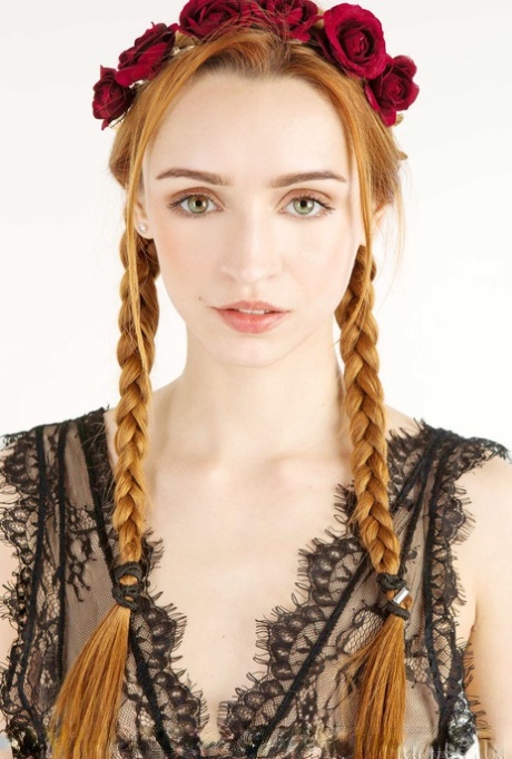 Beautiful redheaded teen Morrigan sports braided pigtails while getting naked 87718417