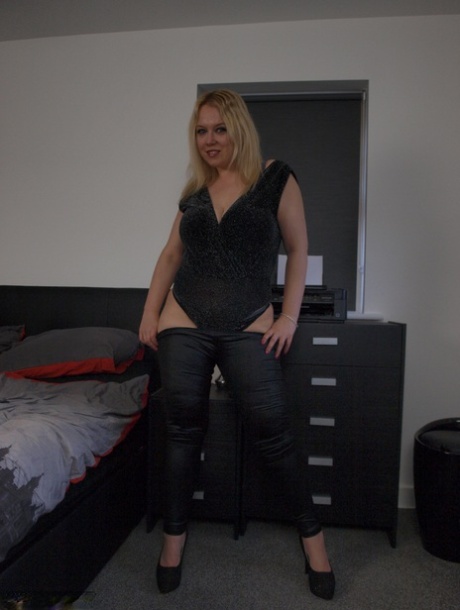 Overweight UK blonde Sindy Bust gets naked atop her bed in high-heeled shoes 49647610