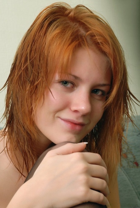 Redheaded young girl Itna hits upon great nude poses in stockings 94528988