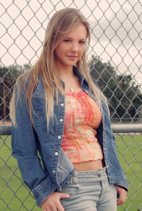 Cute blonde Dawson Miller uncovers her big natural tits at a ball diamond 57259995