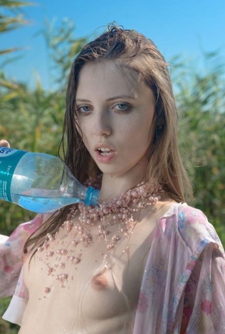 Young looking girl Catalina goes totally naked in front of long weeds 36853458