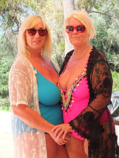 Mature blonde fatty Melody and her lesbian lover have foot play near a pool 67311604