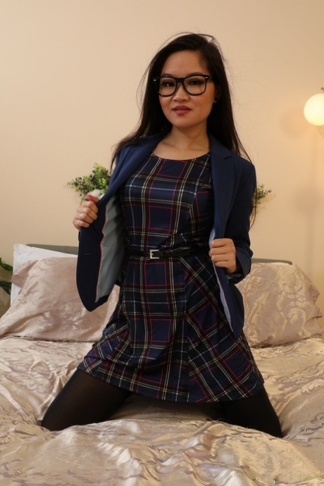 Cute Asian girl Louisa Lu uncovers her small tits in glasses and pantyhose 10465762