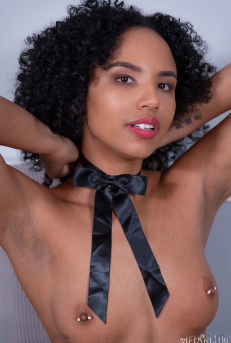 Ebony teen Romy Indy reveals her pierced nipples while going bare naked 51086999