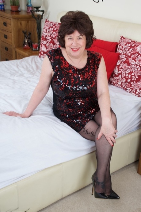 Older plumper Dirty Doctor fondles her natural tits on a bed in nylons 67841433