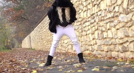 Blonde girl Henriet sports ripped pants while pissing on a paved walkway 31737741