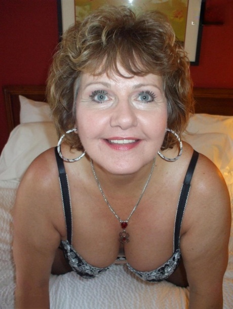 Mature lady Busty Bliss models in her underthings and arm socks in stockings 19287767