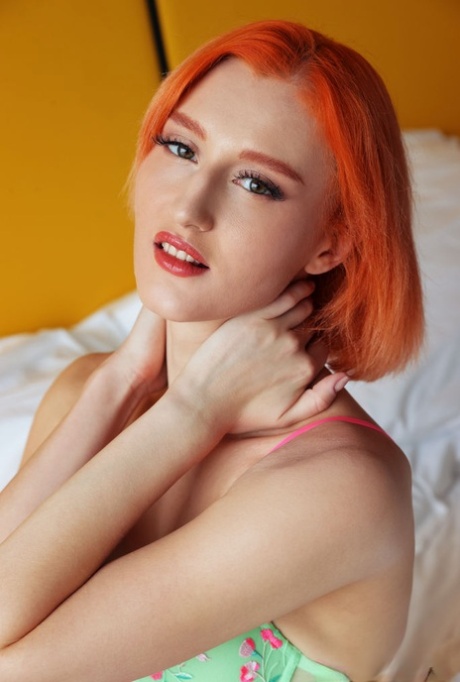 Redheaded teen Lola Red reveals her hairless pussy while getting bare naked 46081976