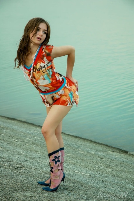 Gorgeous teen Eivor H gets naked at the water in sexy footwear 57934442
