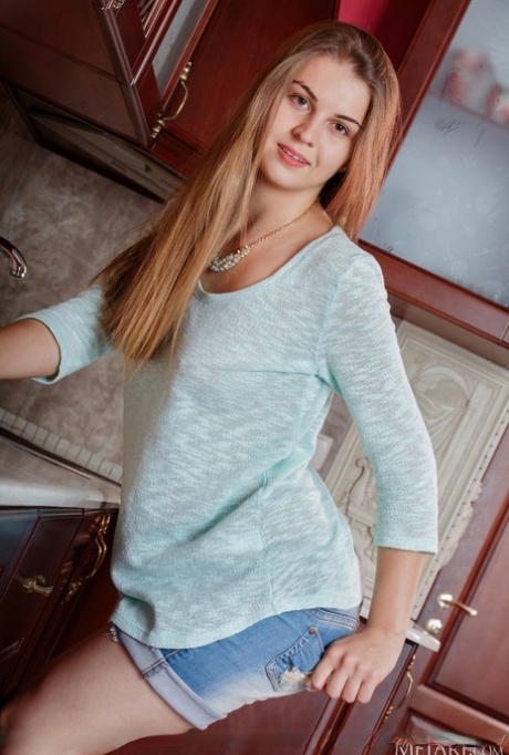 Skinny teen Bella Libre unveils her great body during solo action in a kitchen 79782188
