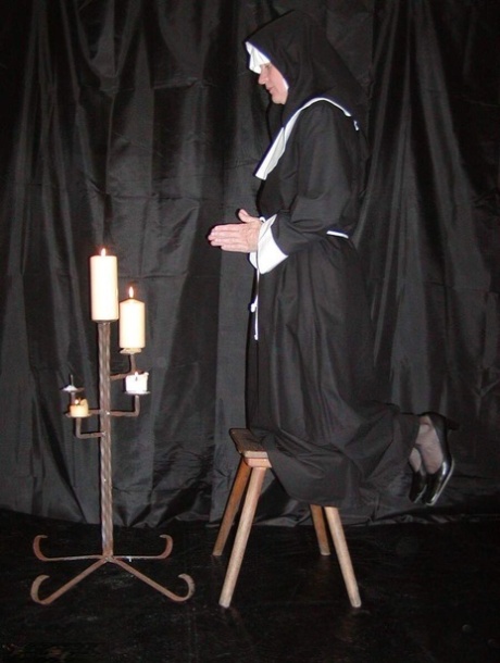 Older blonde nun Tiffany Pearl exposes her tits and pussy during a solo show 83394696