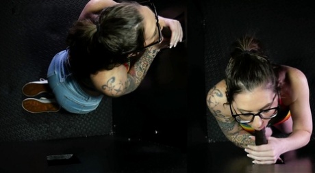 Tattooed brunette Nikki Zee sucks off a bunch of cocks at a gloryhole 95421129