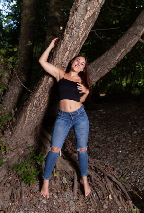 Brunette teen Sumiko shows her great body in a dense forest setting 48728453