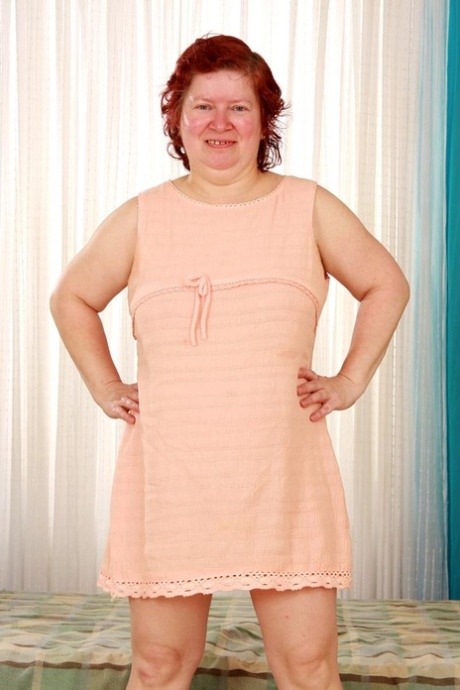 Older BBW with red hair sports a creampie after sex on a bed 32464533