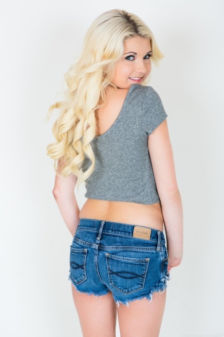 Petite blonde Henley Hart uncovers her teenie tits before standing naked 62989502