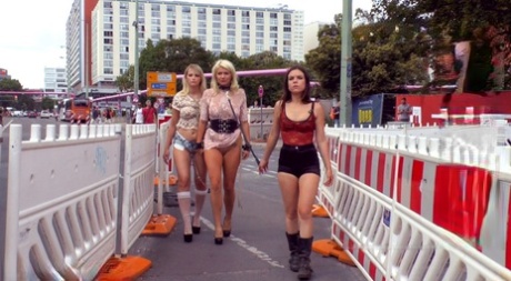 Blonde slaves are paraded in public before outdoor blowjobs and public fucking 10076425