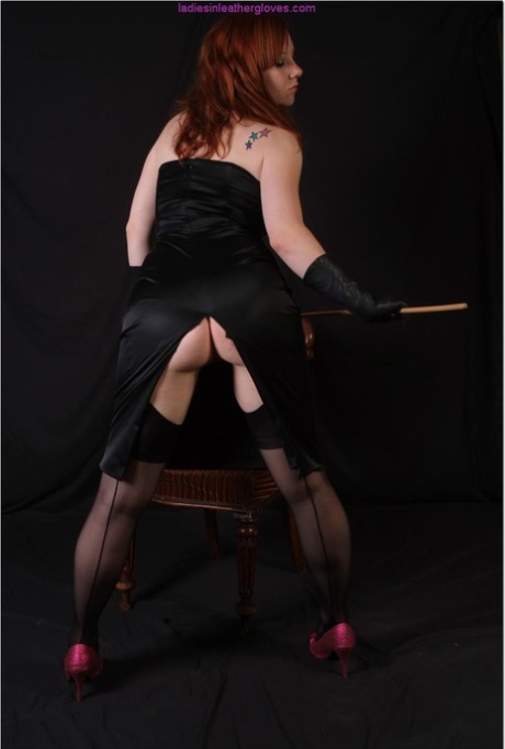 Sexy redhead flexes a cane before touching her tight slit with leather gloves 64365105