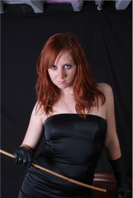 Sexy redhead flexes a cane before touching her tight slit with leather gloves 64365105