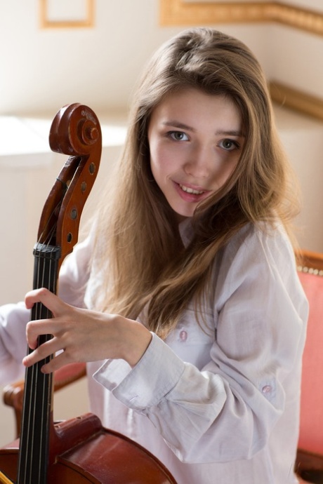 Cute teen girl Milla puts here cello away and opts for a nude modeling career 80619881