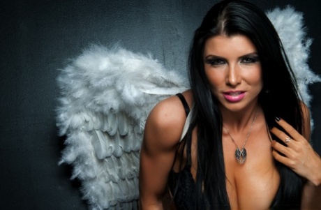 Dark haired MILF Romi Rain dons a masquerade mask while wearing angel wings 68578561