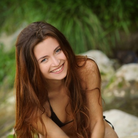 Wet and skinny Euro babe freeing tiny teen tits from bikini for glam pics 32223159